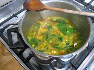 Soup with spinach and herbs added